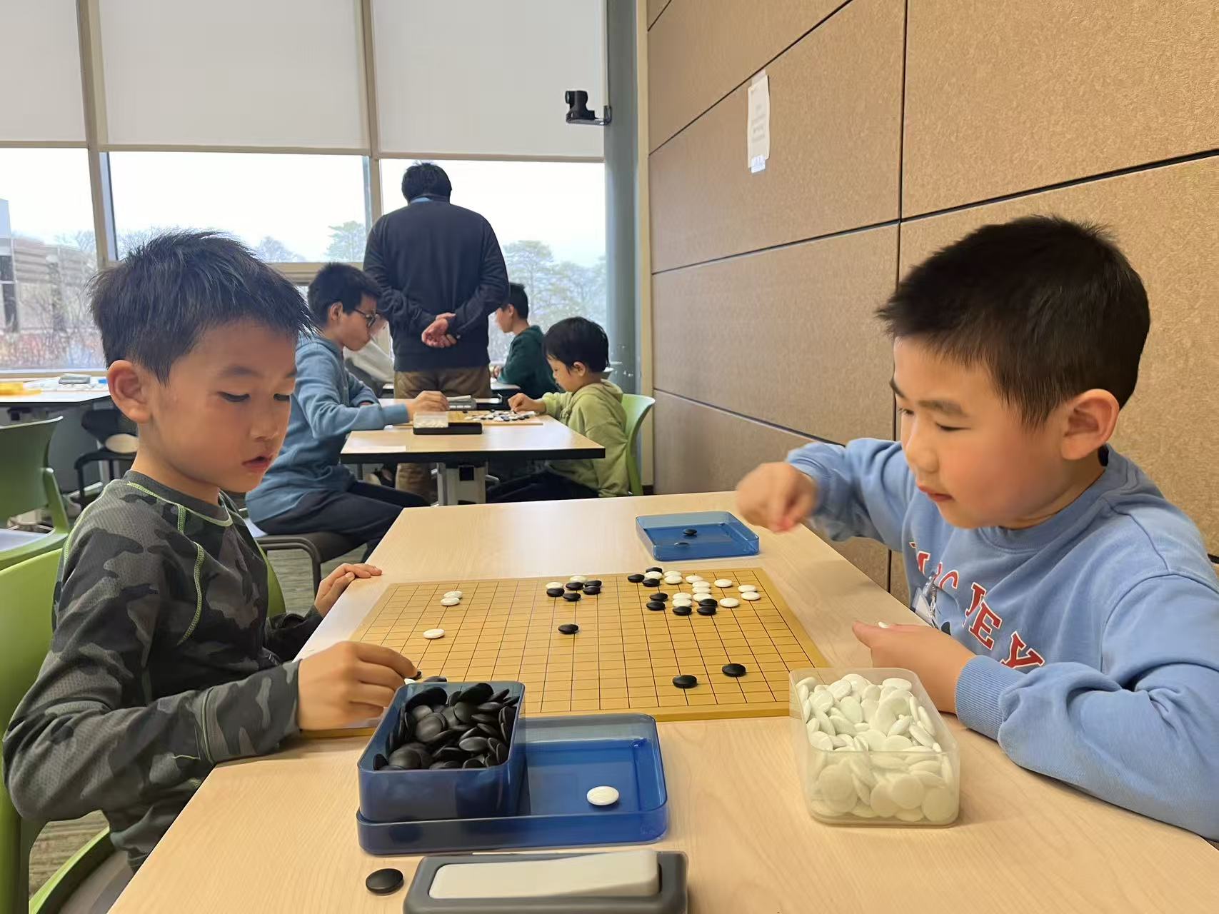 Young Go player concentrating on the board